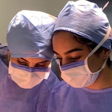 Two surgeons with facemasks